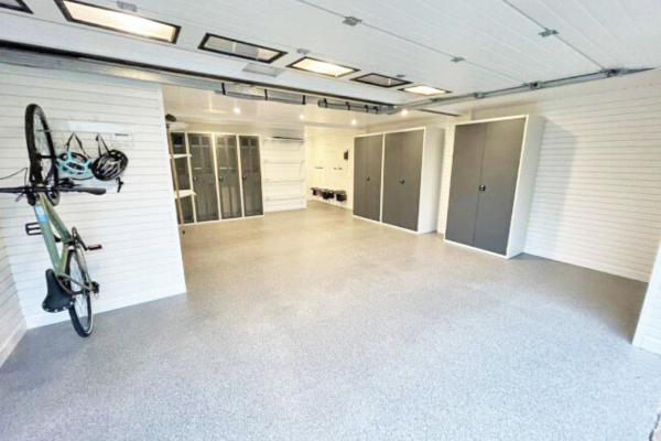 big garage with big variety of storage solutions and cupboards